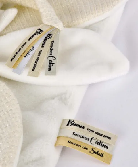 Doudou et Compagnie Doudou plat pétales Ours Blanc - 25 cm - Collection Anniversaire> Doudou Plat