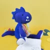 Doudou et Compagnie Peluche de dinosaure bleu avec doudou - Sashou - 25 cm